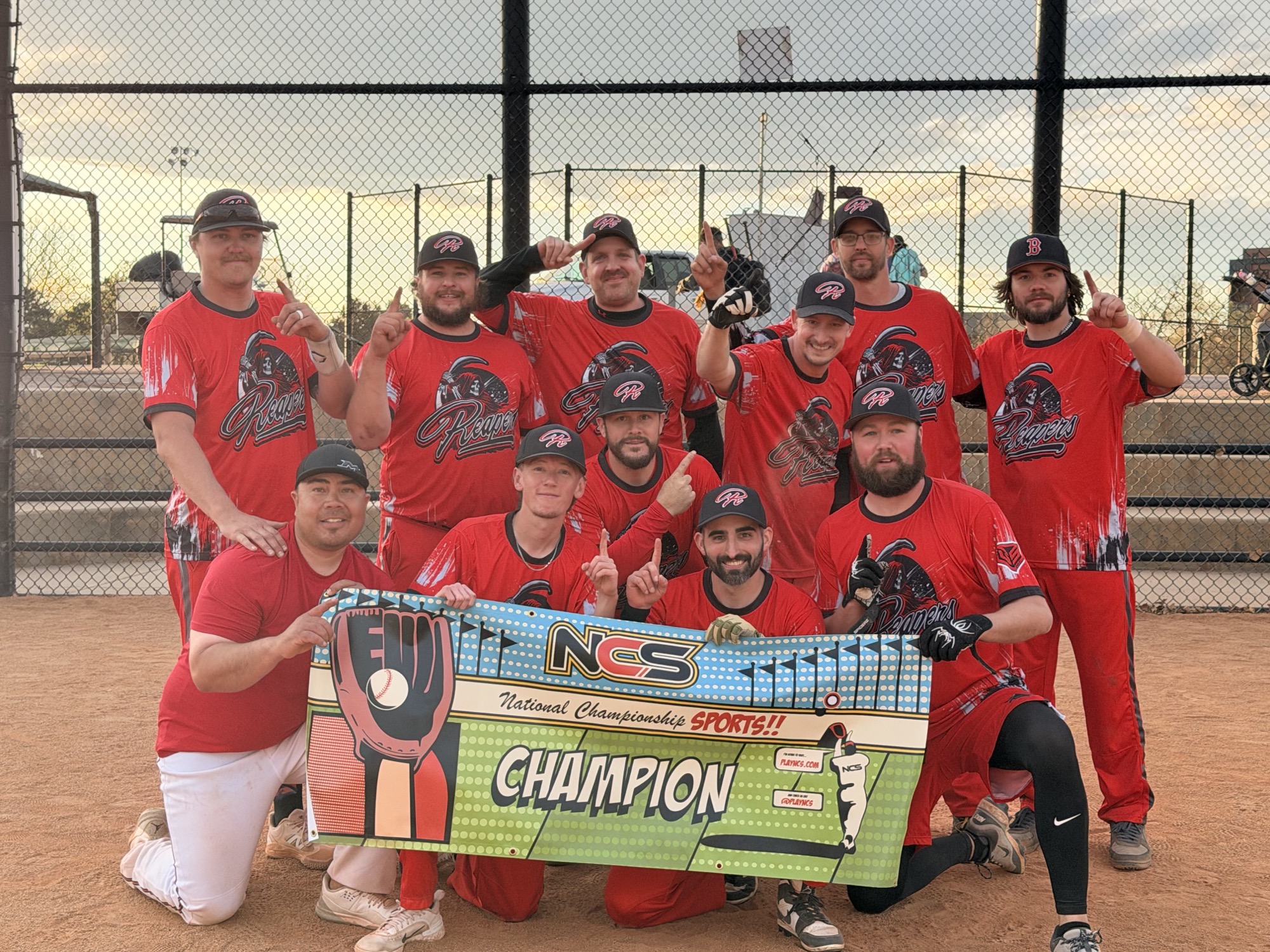 The Reapers holding the NCS Champion banner at the field